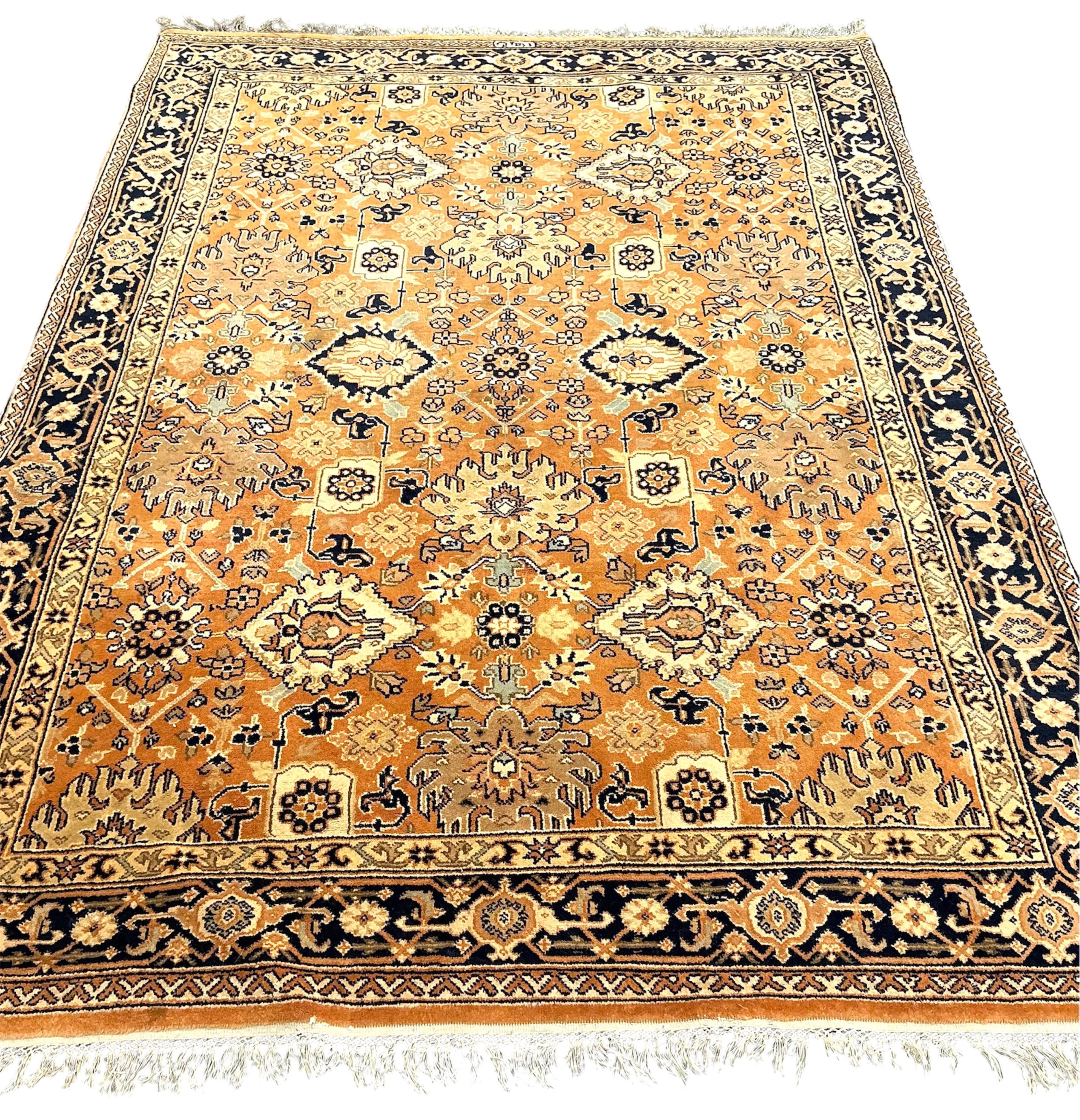 A North West Persian style peach ground carpet, 230 x 168cm
